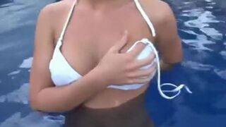 Beauty_busty_strip_off_in_the_pool_softcore