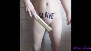 Slave stripping and spanking herself on the clitoris and pubis