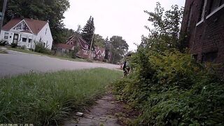 Black Detroit Street Hooker in tight extremely short dress.