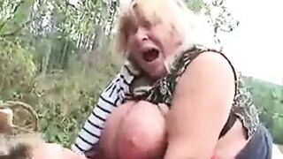 Big Tit Granny Fucks in the Woods