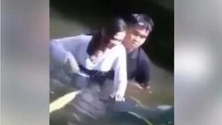 couple do romance in a river.mp4