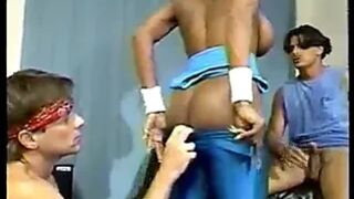 Fit black chick with huge tits goes down on 2 white cocks
