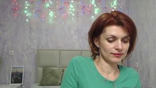 Busty ginger MILF showing boobs in sweater