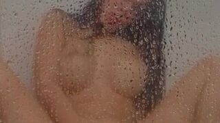 Latina is fingering in the shower