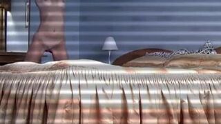 Uninhibited blonde takes her clothes off and goes to bed in