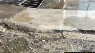 Cute asian takes a pee while clothed