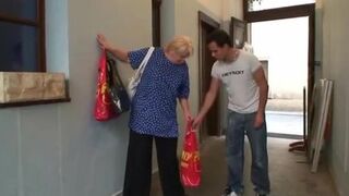 Granny with big tits is happy to take a younger cock